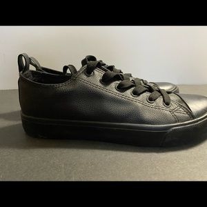 Black leather like sneakers.